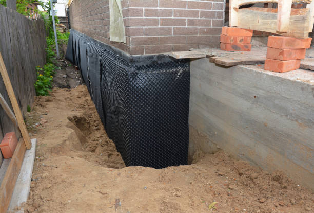 SJ Waterproofing Pros technician performing targeted Emergency Waterproofing assessment in Upland, IN